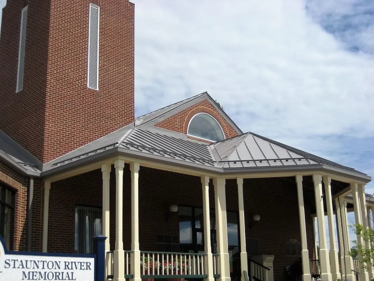 Skilled roofing craftsmen working on a residential roof in Willisville